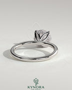 Kynora CJ 2ct round claw solitaire engagement ring with petal gallery and accented tiara detail, showcasing intricate design and sparkling diamond.