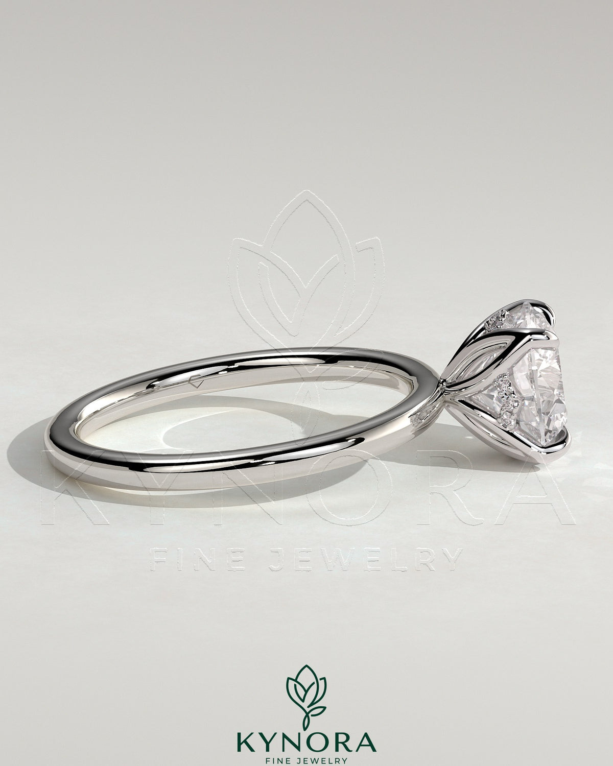 Kynora CJ 2ct round claw solitaire engagement ring with petal gallery and accented tiara detail, showcasing intricate design and sparkling diamond.
