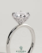 Kynora CJ 2ct round claw solitaire engagement ring with petal gallery and accented tiara detail, showcasing intricate design and sparkling diamond.