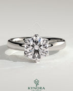 Kynora CJ 2ct round claw solitaire engagement ring with petal gallery and cigar band design in sterling silver.