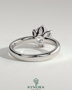 Kynora CJ 2ct round claw solitaire engagement ring with petal gallery and cigar band design, showcasing intricate metalwork and sparkling diamond
