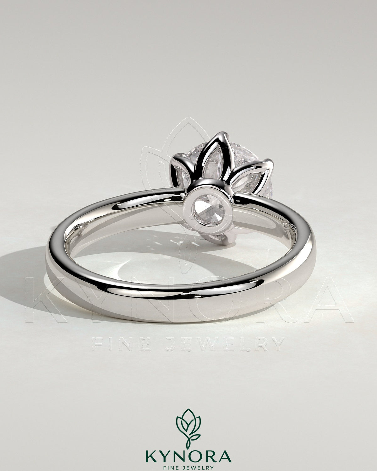 Kynora CJ 2ct round claw solitaire engagement ring with petal gallery and cigar band design, showcasing intricate metalwork and sparkling diamond