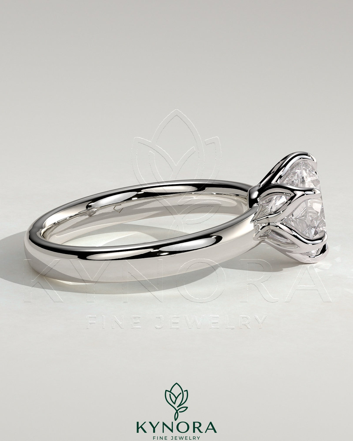 Kynora CJ 2ct round claw solitaire engagement ring with petal gallery and cigar band design in silver or white gold.