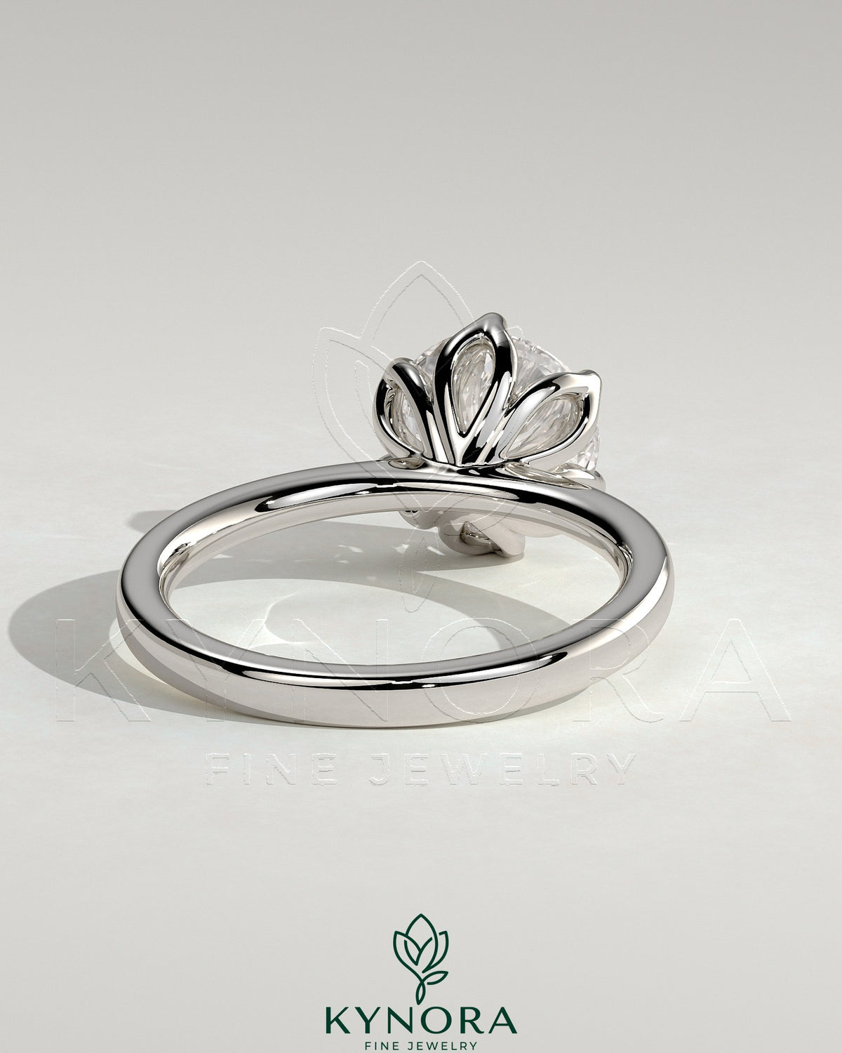 Kynora CJ 2ct round claw solitaire engagement ring with petal gallery and tapered band showcasing elegant jewelry design.