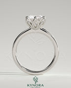 Kynora CJ 2ct round claw solitaire engagement ring with petal gallery detail and tapered band in sterling silver.
