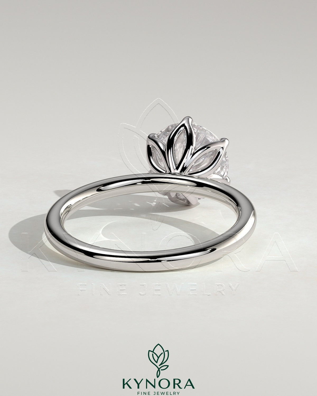 Kynora CJ 2-carat round claw solitaire engagement ring with petal gallery design and sparkling diamond setting