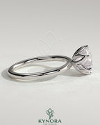 Kynora CJ 2ct round claw solitaire engagement ring featuring a petal gallery design with a sparkling central diamond.