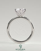 Kynora CJ 2ct round claw solitaire engagement ring with petal gallery design in polished metal setting.