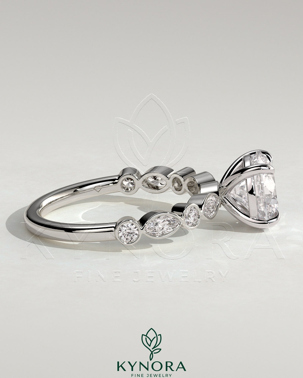 Kynora CJ 2ct round claw solitaire engagement ring with round-marquise bezel accent stones, elegant and sparkling jewelry piece.