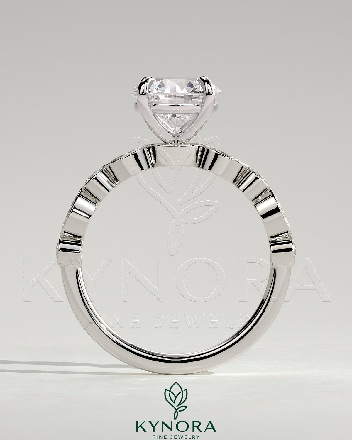 Kynora CJ 2ct round claw solitaire engagement ring with round-marquise bezel accent stones, showcasing sparkling diamond design.