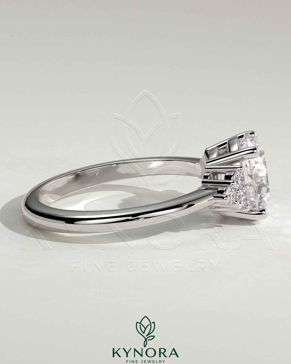 Kynora CJ 2-carat round claw solitaire engagement ring with round shoulder stones, featuring a sparkling central gemstone.