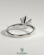 Kynora CJ 2ct round diamond claw solitaire engagement ring with a solid cathedral high setting showcasing the sparkling diamond.