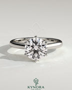 Kynora CJ 2ct round diamond claw solitaire engagement ring with solid cathedral low setting, elegant and timeless design.