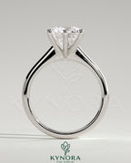 Kynora CJ 2ct round diamond solitaire engagement ring with a solid cathedral low setting and claw prongs.