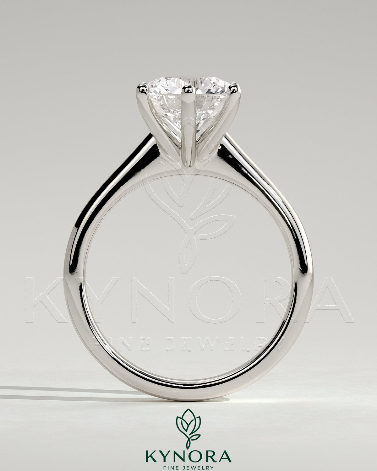 Kynora CJ 2ct round diamond solitaire engagement ring with a solid cathedral low setting and claw prongs.