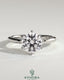 Kynora CJ 2ct round claw solitaire engagement ring with sweeping micropavé band, showcasing elegant diamond setting and craftsmanship.