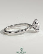 Kynora CJ 2ct round claw solitaire engagement ring with sweeping micropavé band, showcasing a sparkling central diamond and elegant design.