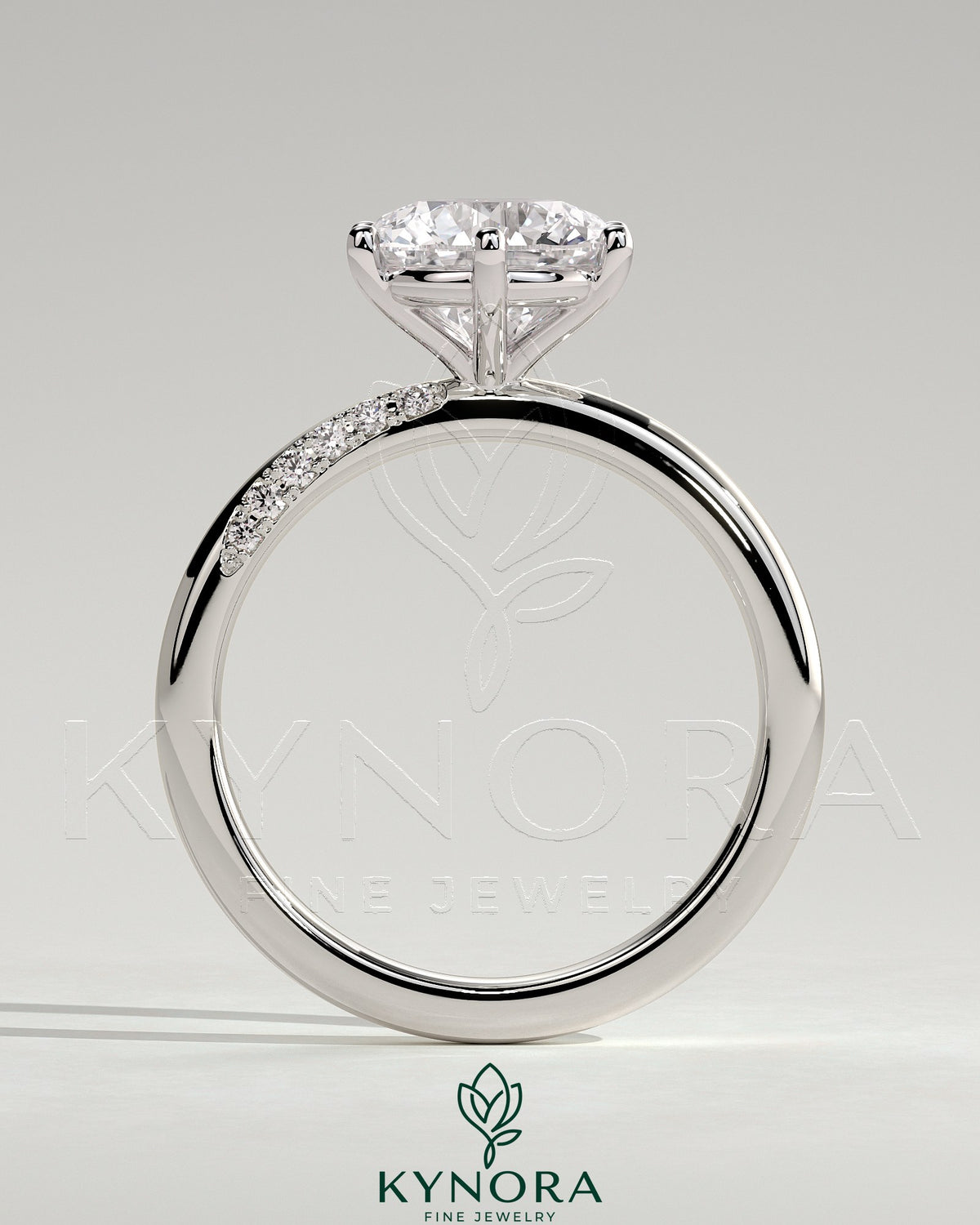 Kynora CJ 2ct round diamond solitaire engagement ring with sweeping micropavé band, elegant and sparkling jewelry piece.
