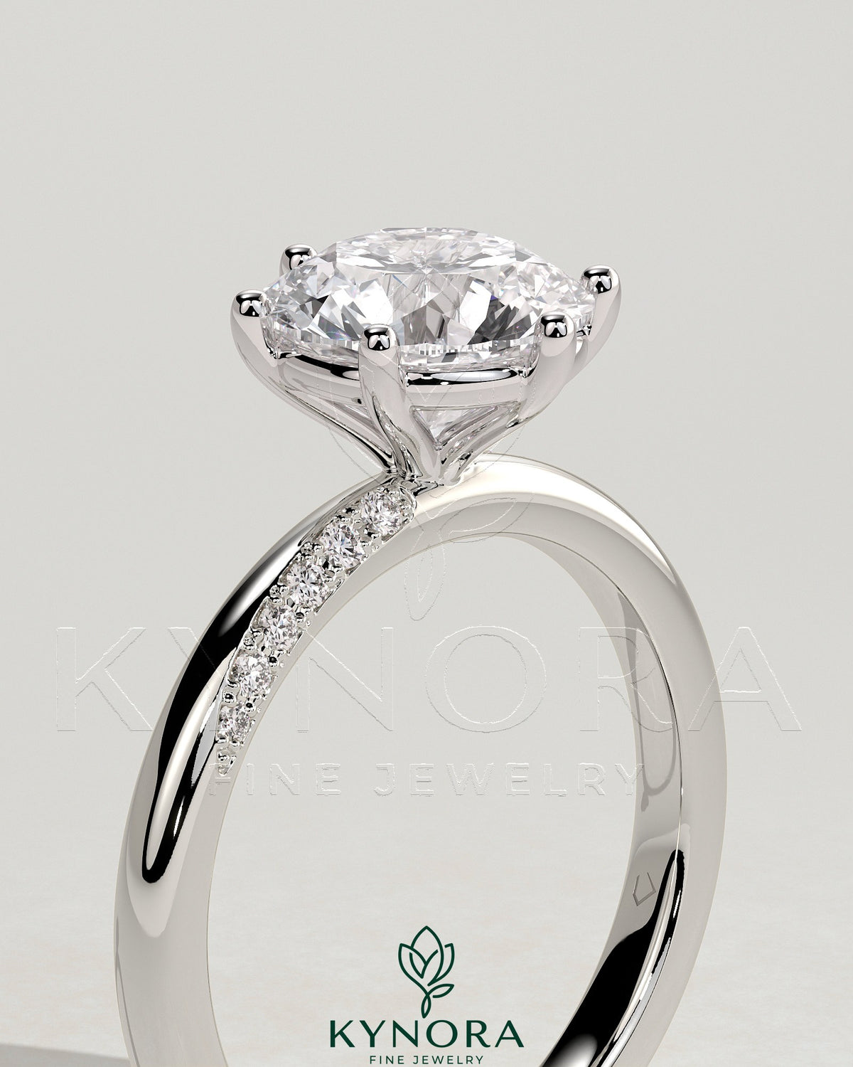 Kynora CJ 2ct round diamond solitaire engagement ring with sweeping micropavé band, elegant and sparkling jewelry piece.