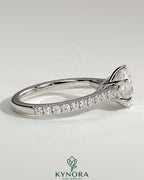 Kynora CJ 2ct round diamond solitaire engagement ring with trellis gallery, pave band, and cathedral low setting.