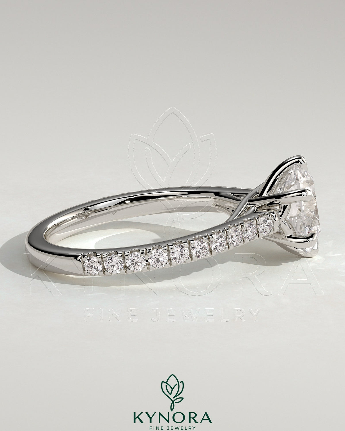 Kynora CJ 2ct round diamond solitaire engagement ring with trellis gallery, pave band, and cathedral low setting.