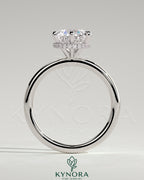 Kynora CJ 2ct round claw solitaire engagement ring with wrap-around hidden halo, showcasing a sparkling central diamond and intricate band design.