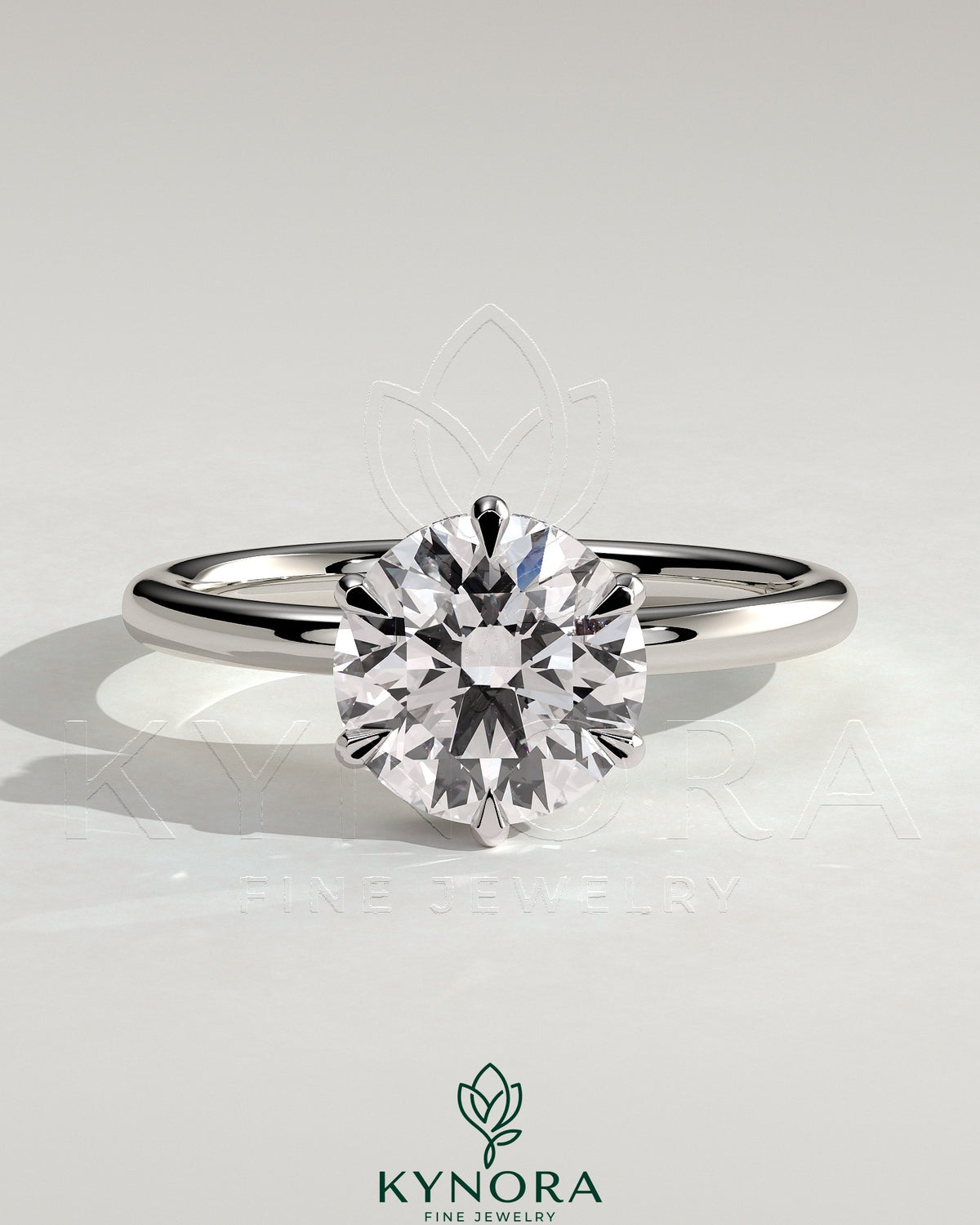 Kynora CJ 2ct round claw solitaire engagement ring with wrap-around hidden halo in polished gold setting.