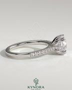 Kynora CJ 2ct round solitaire engagement ring with double claw, hidden halo, tapered pave band, cathedral high setting.