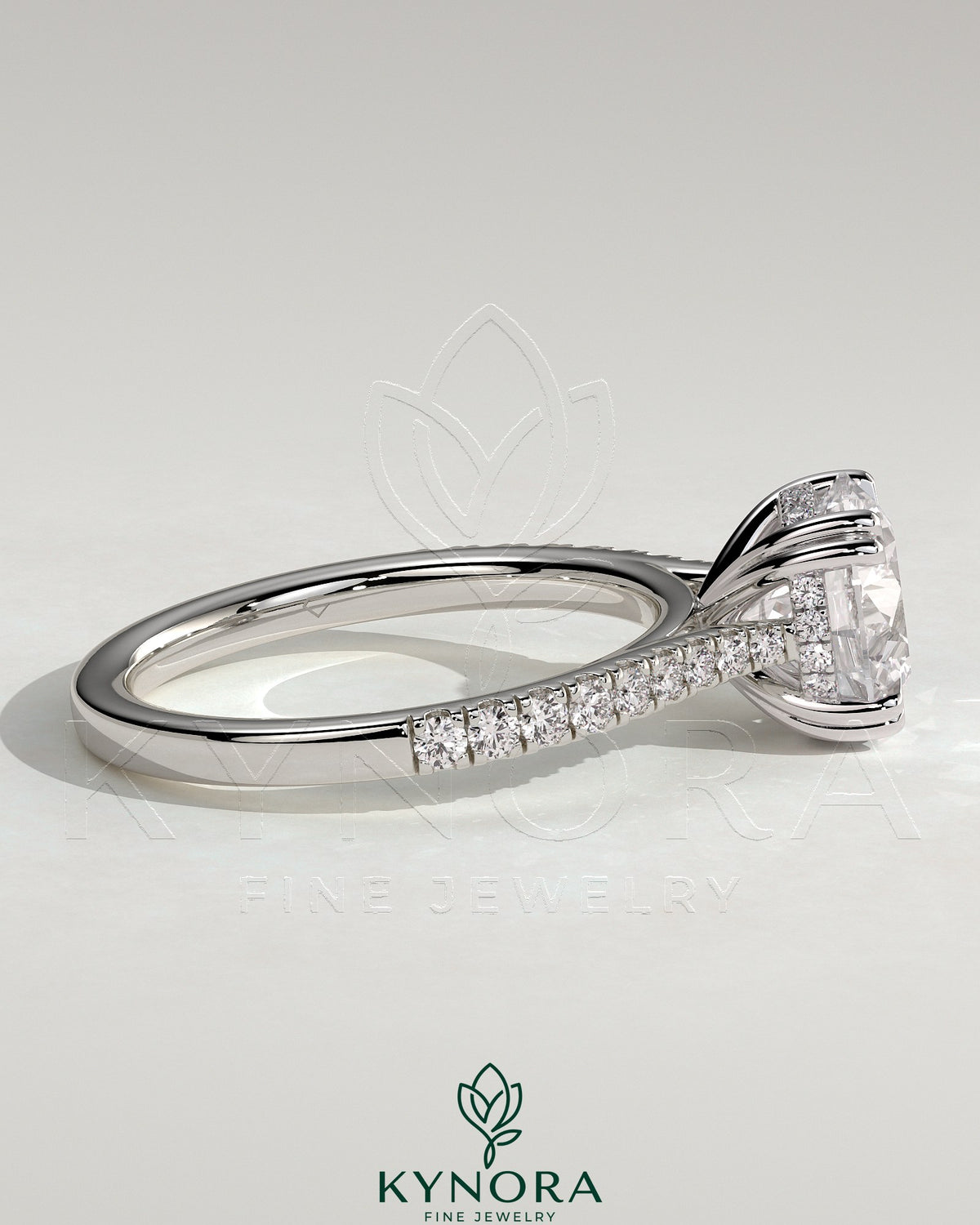 Kynora CJ 2ct round solitaire engagement ring with double claw, hidden halo, tapered pave band, cathedral high setting.