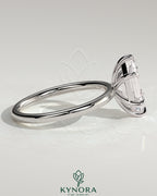 Kynora CJ Classic 2ct elongated hexagon claw solitaire engagement ring with a platinum band and sparkling center stone.