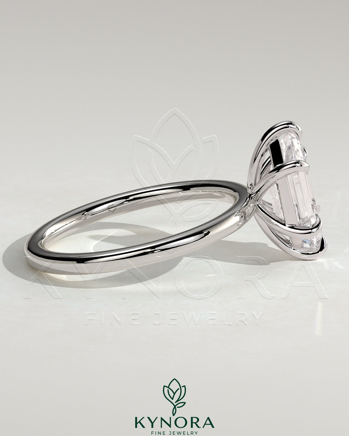 Kynora CJ Classic 2ct elongated hexagon claw solitaire engagement ring with a platinum band and sparkling center stone.