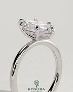 Kynora CJ classic 2ct marquise claw solitaire engagement ring with a sleek gold band and a prominent marquise-shaped diamond.
