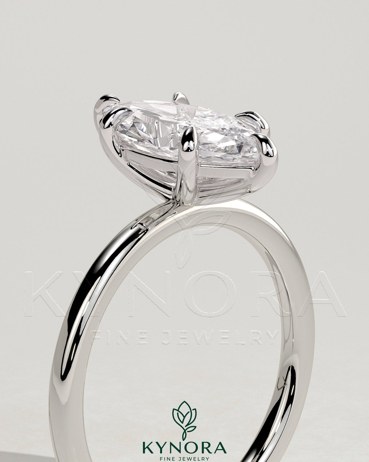 Kynora CJ classic 2ct marquise claw solitaire engagement ring with a sleek gold band and a prominent marquise-shaped diamond.