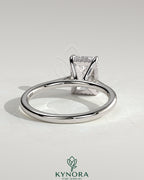 Kynora CJ Radiant Claw Solitaire engagement ring with hidden halo, tapered band, and cathedral high setting showcasing the sparkling gemstone.