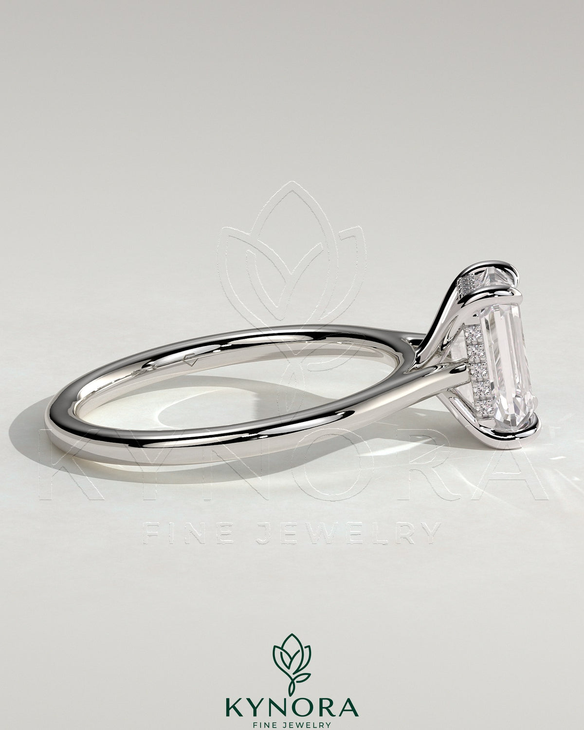 Kynora CJ Radiant Claw Solitaire Engagement Ring with hidden halo, tapered band, and cathedral high setting, showcasing a sparkling center stone.