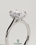 Kynora CJ Radiant Claw Solitaire engagement ring with hidden halo, tapered band, and cathedral high setting in sterling silver