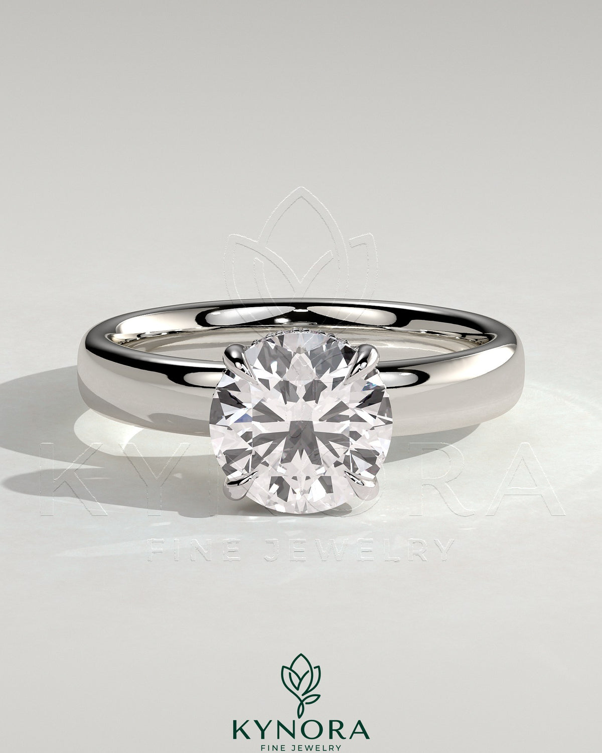 Kynora CJ statement 2ct round diamond claw solitaire engagement ring with cigar band and hidden halo, showcasing elegant jewelry craftsmanship.