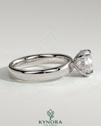 Kynora CJ statement 2-carat round claw solitaire engagement ring with cigar band and hidden halo, showcasing intricate design.
