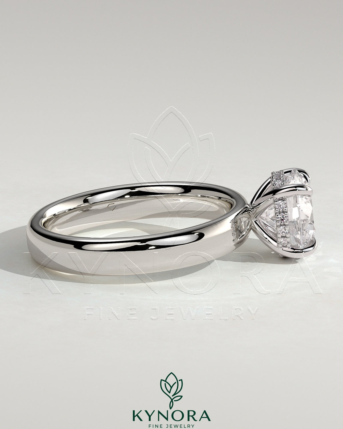 Kynora CJ statement 2-carat round claw solitaire engagement ring with cigar band and hidden halo, showcasing intricate design.