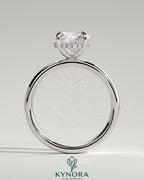 Kynora CJ statement 2ct round claw solitaire engagement ring with cigar band and hidden halo, showcasing elegant jewelry design