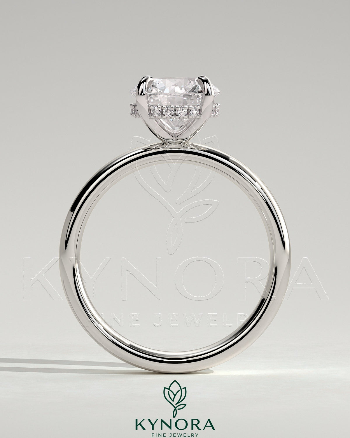 Kynora CJ statement 2ct round claw solitaire engagement ring with cigar band and hidden halo, showcasing elegant jewelry design