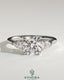 Kynora CJ 2ct cushion claw trilogy engagement ring with pear side stones and open trellis gallery design.