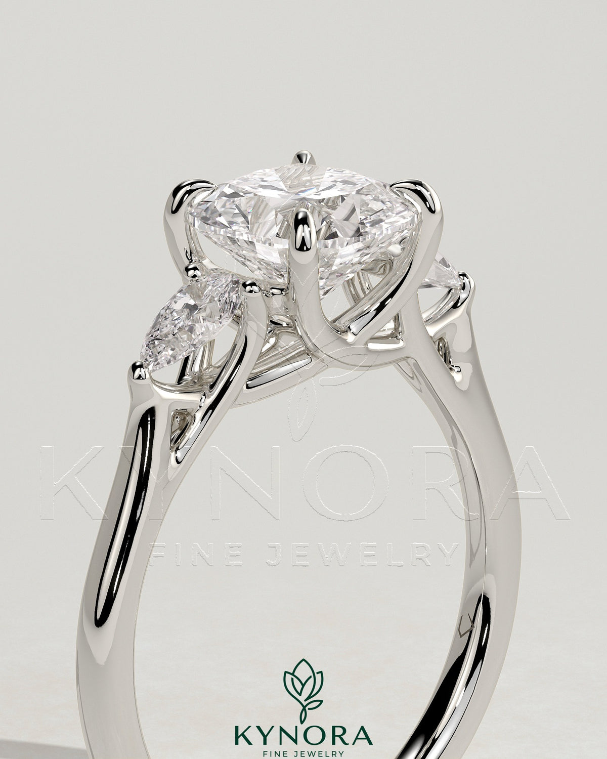Kynora CJ 2ct cushion claw trilogy engagement ring with pear side stones and open trellis gallery design