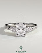 Kynora CJ 2ct elongated cushion cut trilogy engagement ring with pear side stones and pave band, elegant three stone design.