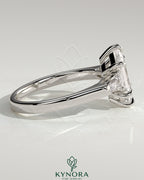 Kynora CJ 2ct elongated hexagon trilogy engagement ring with tapered baguette side stones and cathedral setting.
