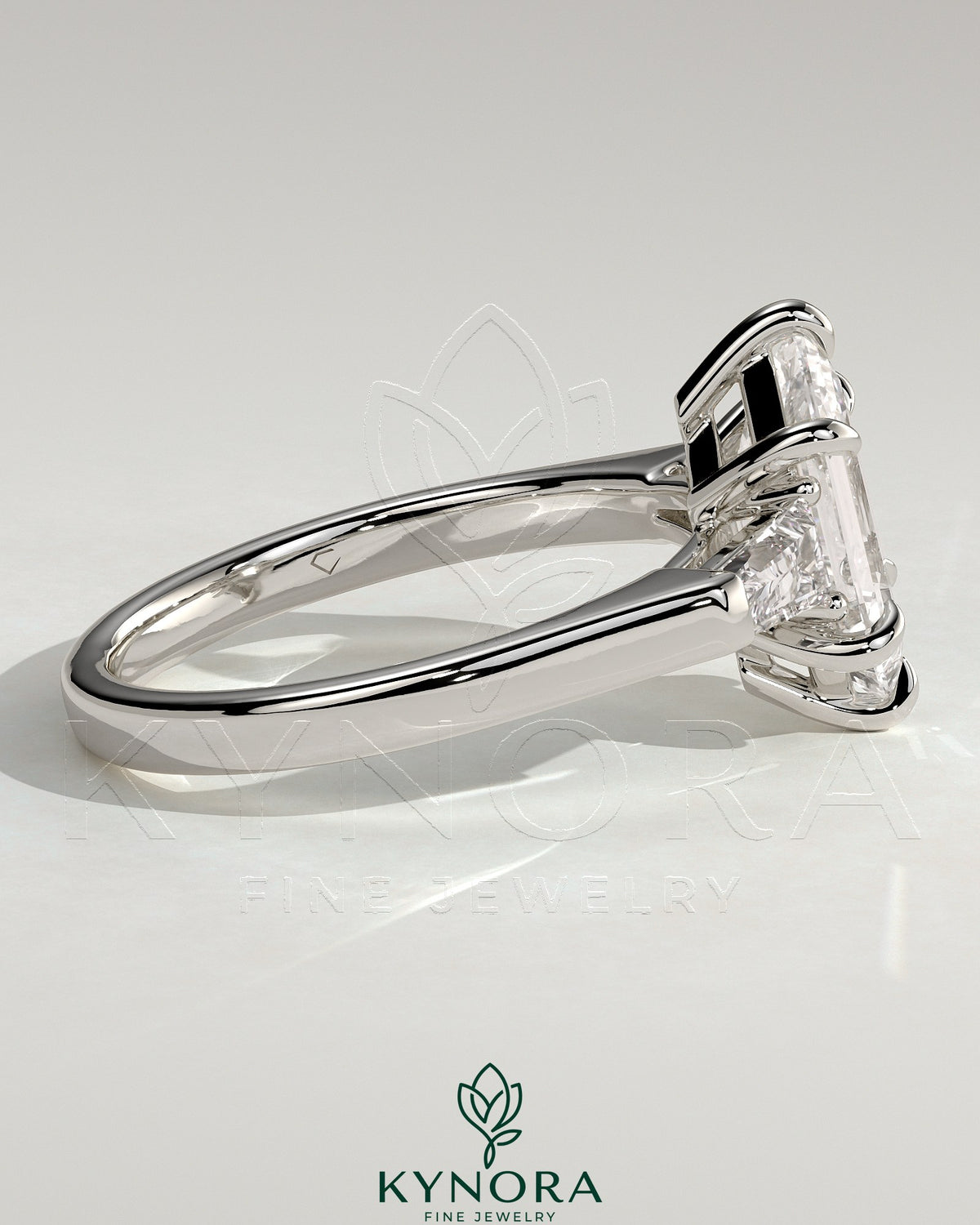 Kynora CJ 2ct elongated hexagon trilogy engagement ring with tapered baguette side stones and cathedral setting.