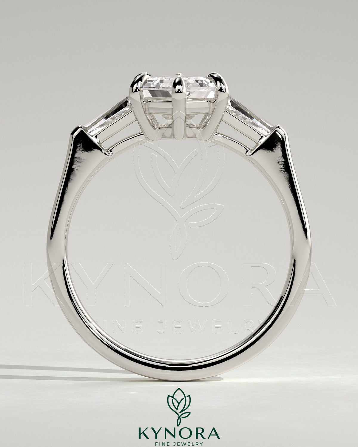 Kynora CJ 2ct elongated hexagon claw trilogy engagement ring with tapered baguette side stones and cathedral setting.