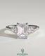 Kynora CJ 2ct emerald claw trilogy engagement ring with pear side stones and cathedral setting in yellow gold.