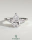 Kynora CJ 2ct pear claw trilogy engagement ring with side stones and cathedral setting, showcasing sparkling diamond design.