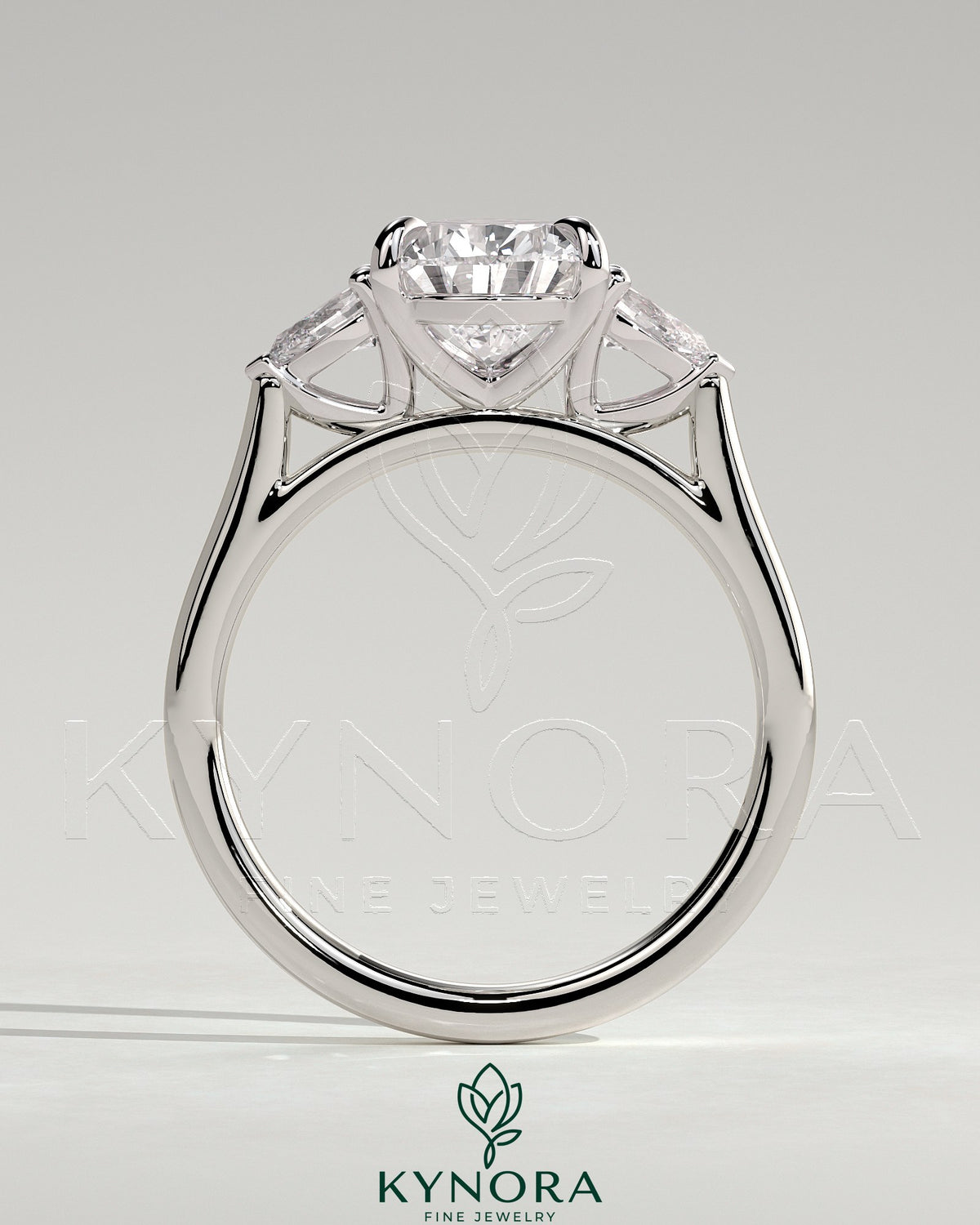 Kynora CJ 2ct Pear Claw Trilogy engagement ring featuring pear side stones and cathedral setting.